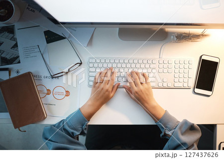 Computer, keyboard and typing with top view of woman and mockup on screen for research, planning and growth analytics. Technology, innovation and future with hands of employee at desk for management 127437626