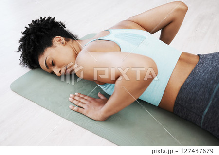 Yoga, meditation and zen woman in pilates for mind and body relaxation with peace, wellness and balance at home. Mindfulness, fitness and spiritual girl training in a calm mindset in the home studio 127437679