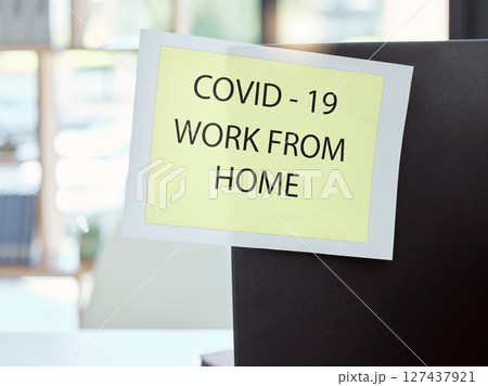 Covid, sign and work from home at the office for health and safety rules or regulations during pandemic. Label post of corona virus restrictions for working remote, quarantine or control at workplace Covid, sign and work from home at the office for health and safety rules or regulations during pandemic. Label post of corona virus restrictions for working remote, quarantine or control at workplace 127437921