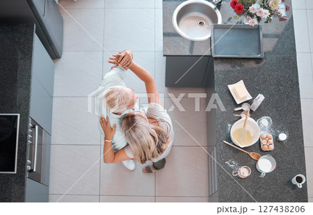 Top view couple, dancing and home kitchen for cooking, happy romance or love bonding together. Senior man, woman dancer or dance movement on floor for steps, touch and retirement house with food 127438206
