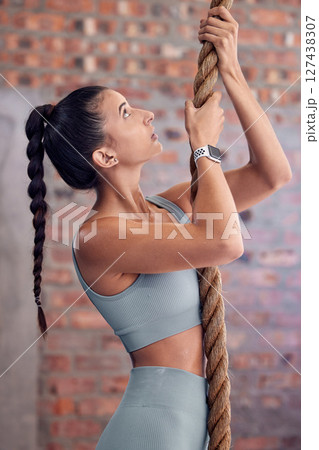 Woman, rope climb and fitness, muscle and strong with upper body workout at gym, active lifestyle and training for health and wellness. Exercise, core strength and endurance with sport motivation. 127438307