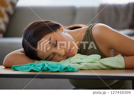 Cleaner, relax and sleep on table in home after cleaning with cloth and rubber gloves. Spring cleaning, burnout and tired woman house worker sleeping, nap or resting after complete household tasks. Cleaner, relax and sleep on table in home after cleaning with cloth and rubber gloves. Spring cleaning, burnout and tired woman house worker sleeping, nap or resting after complete household tasks. 127438309