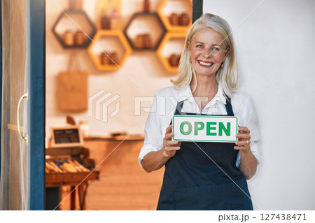 Open sign, woman and small business for honey, retail and shop with smile in portrait and happy with natural product startup business. Elderly business owner, organic and raw, store with shopkeeper. 127438471