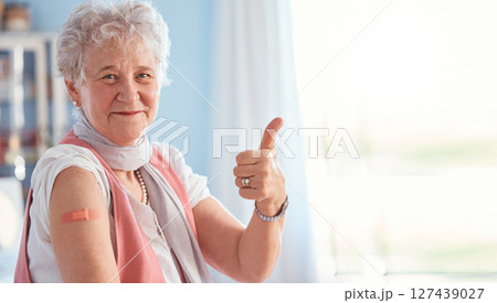 Senior woman, vaccine and covid with thumbs up in portrait, hospital and smile with plaster. Happy elderly lady, vaccination and yes hand for safety, healthcare or medical protection against covid 19 Senior woman, vaccine and covid with thumbs up in portrait, hospital and smile with plaster. Happy elderly lady, vaccination and yes hand for safety, healthcare or medical protection against covid 19 127439027