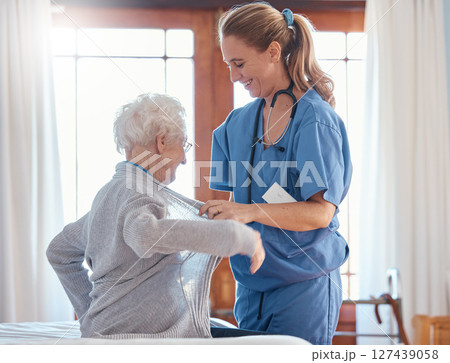 Nurse, healthcare and senior woman in nursing home with physician helping her dress up. Disability, rehabilitation and female medical worker with retired patient in home with care, empathy or support Nurse, healthcare and senior woman in nursing home with physician helping her dress up. Disability, rehabilitation and female medical worker with retired patient in home with care, empathy or support 127439058