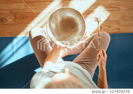 Yoga, wellness and meditation sound therapy of a senior woman doing zen, spiritual and calm workout. Above view of meditate, fitness and mindfulness exercise training on the living room ground Yoga, wellness and meditation sound therapy of a senior woman doing zen, spiritual and calm workout. Above view of meditate, fitness and mindfulness exercise training on the living room ground 127439239