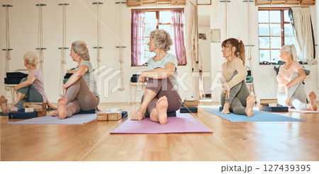 Yoga, personal trainer and senior women community, group and support for healthy life, wellness and body stretching. Elderly, coach and yoga class people on floor in pilates, cardio or workout studio Yoga, personal trainer and senior women community, group and support for healthy life, wellness and body stretching. Elderly, coach and yoga class people on floor in pilates, cardio or workout studio 127439395