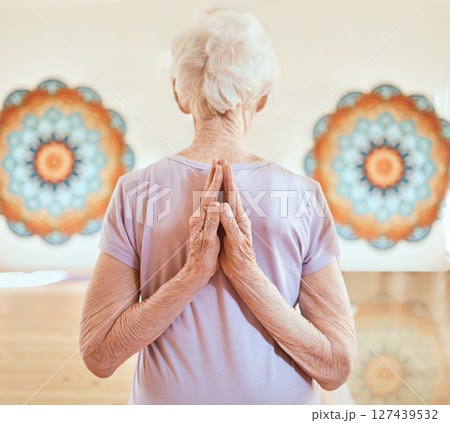 Elderly woman in pose for yoga, flexibility and fitness in studio, hands with arms stretching and vitality in old age. Balance, exercise and chakra with peace and body training and wellness. Elderly woman in pose for yoga, flexibility and fitness in studio, hands with arms stretching and vitality in old age. Balance, exercise and chakra with peace and body training and wellness. 127439532