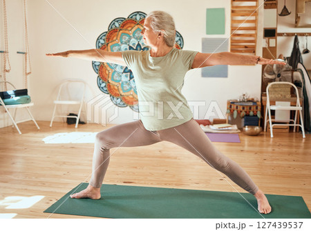 Senior yoga, training and woman pilates stretching of a elderly person feeling zen and relax. Spiritual balance exercise in a wellness studio for healthy lifestyle, meditation fitness and workout 127439537