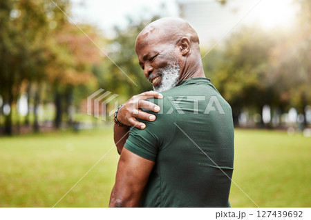Senior black man with shoulder pain, fitness injury and exercise in the park with muscle ache or inflammation outdoor. Health, accident during workout and hurt, elderly person with pain from sport. 127439692