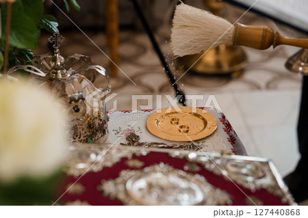 Orthodox Wedding Ceremony Details: Silver Paten, Brush, and Floral Decorations on Red Cloth - Religious Ritual and Christian Traditions. Orthodox Wedding Ceremony Details: Silver Paten, Brush, and Floral Decorations on Red Cloth - Religious Ritual and Christian Traditions. 127440868