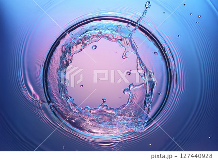 水飛沫でできた輪 青色にピンク色の光 水飛沫でできた輪 青色にピンク色の光 127440928