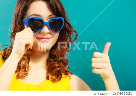 Girl in blue sunglasses portrait 127441526