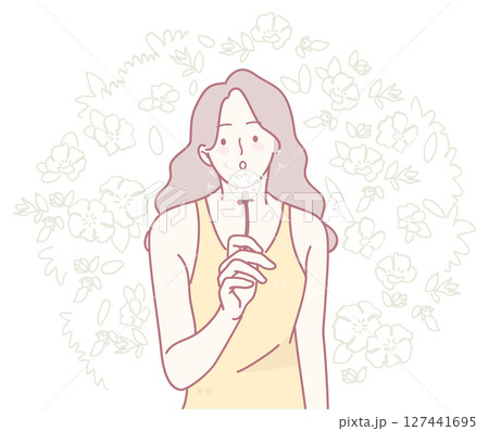 A Thoughtful Woman Gracefully Surrounded by Beautiful Floral Elements and Natural Imagery 127441695
