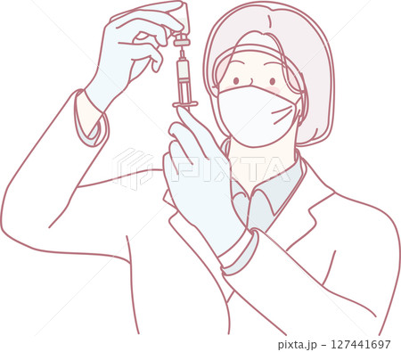 A healthcare professional prepares a vaccine for the community health initiative against COVID19 127441697