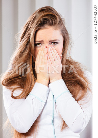 Sad woman cover face with hands Sad woman cover face with hands 127442037
