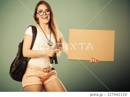 woman hitchhiking with blank sign for your text. 127442119