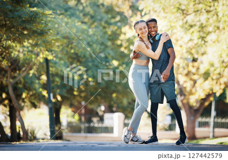 Workout, couple and hug in park portrait for exercise, fitness and walk break with smile for affection. Interracial, love and wellness of happy people dating on cardio rest together in New York. 127442579
