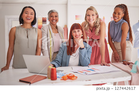 Laptop, fashion and team of creative women in meeting to plan a project together in the office. Diversity, designers and portrait of female group in collaboration working on clothes in the workplace. 127442617