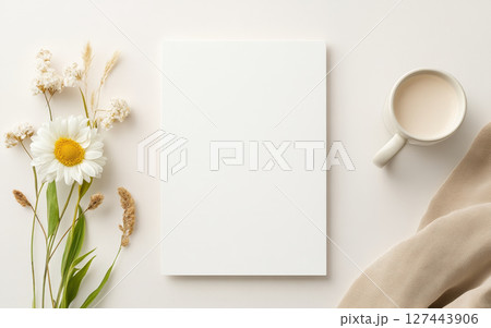 Minimalist blank white menu with flowers and cup on light background. Perfect for elegant presentations 127443906