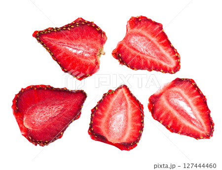 Dried strawberry slices isolated on white background. Dehydrated strawberries chips. Clipping path. Top view. Dried strawberry slices isolated on white background. Dehydrated strawberries chips. Clipping path. Top view. 127444460