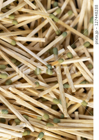 scattered matches without matchboxes , a large number of wooden matches scattered in a large pile scattered matches without matchboxes , a large number of wooden matches scattered in a large pile 127448288
