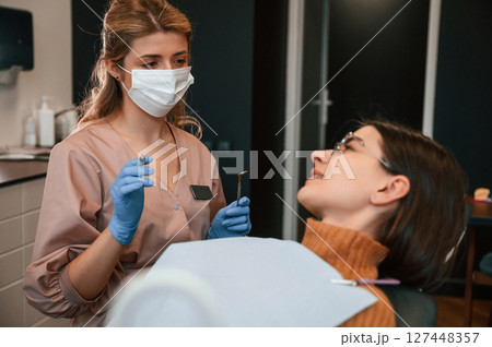 Young woman is in the chair. In the stomatological cabinet 127448357