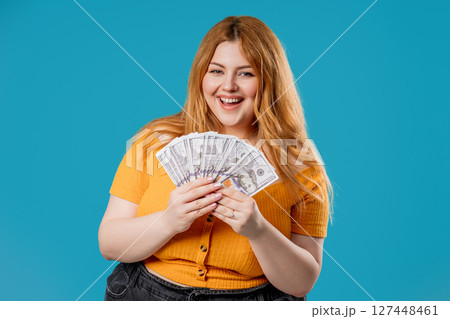 Body Positive Woman With Money. Plus size Lady, Usd Dollars Banknotes On Blue Body Positive Woman With Money. Plus size Lady, Usd Dollars Banknotes On Blue 127448461