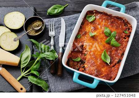 Eggplant Parmigiana in a baking dish, top view Eggplant Parmigiana in a baking dish, top view 127451048