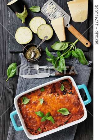 Eggplant Parmigiana in a baking dish, top view Eggplant Parmigiana in a baking dish, top view 127451050