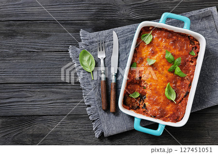 Eggplant Parmigiana in a baking dish, top view 127451051