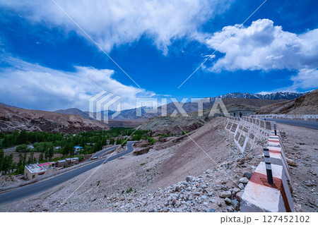 Mountain Road in a Desert Valley 127452102