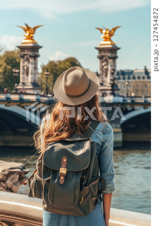 woman hat river triomphe background backpack 127454872