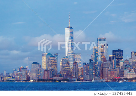 A vibrant sunset panorama of Manhattan downtown skyline, viewed from the river 127455442