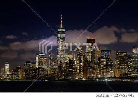 A vibrant sunset panorama of Manhattan downtown skyline, viewed from the river 127455443