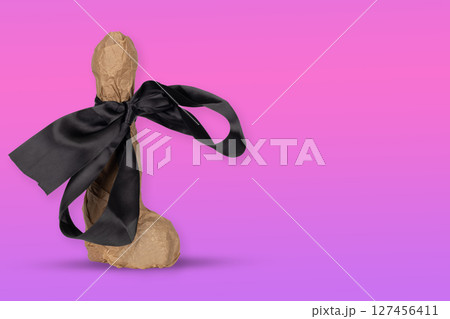 Wrapped Erotic Gift with Black Satin Bow Wrapped Erotic Gift with Black Satin Bow 127456411