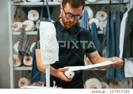 Bandages the raw material. Technician working in modern laboratory Bandages the raw material. Technician working in modern laboratory 127457195