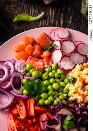 Balanced healthy bowl with vegetables and salmon 127459132