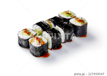 Delicious sushi rolls with eel, avocado, and unagi sauce drizzled on white background Delicious sushi rolls with eel, avocado, and unagi sauce drizzled on white background 127459547