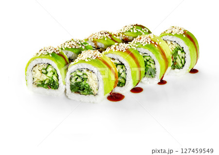 Green dragon sushi rolls with avocado, cucumber, sesame seeds and unagi sauce drizzled on white background 127459549