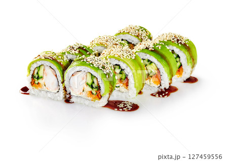 Green dragon sushi rolls with avocado, sesame seeds, and unagi sauce drizzled on white background Green dragon sushi rolls with avocado, sesame seeds, and unagi sauce drizzled on white background 127459556