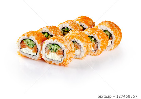Sushi rolls with red tobiko caviar, salmon, cucumber and cream cheese lying on white reflecting table 127459557