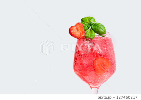 Glass of  strawberry and basil summer cocktail 127460217