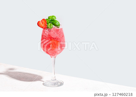 Glass of  strawberry and basil summer cocktail 127460218