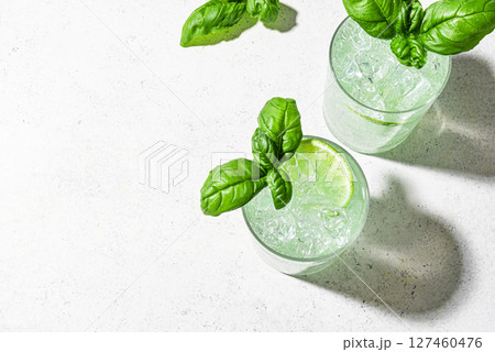 Summer green cocktail drink with lime and basil 127460476