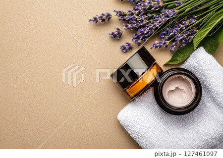Lavender Cream and Twine on a Soft Towel With Fresh Lavender Sprigs Nearby. 127461097