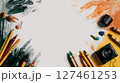 Creative Workspace Featuring Colorful Art Supplies and Drawing Tools on White Canvas 127461253