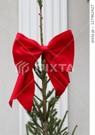 A red bow on the Christmas tree. A red bow on the Christmas tree. 127462427