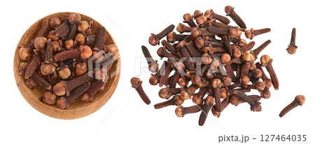 Dry spice cloves in wooden bowl isolated on white background . Top view. Flat lay 127464035