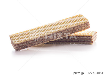 Sweet wafers filled with chocolate cream isolated on white background. 127464081